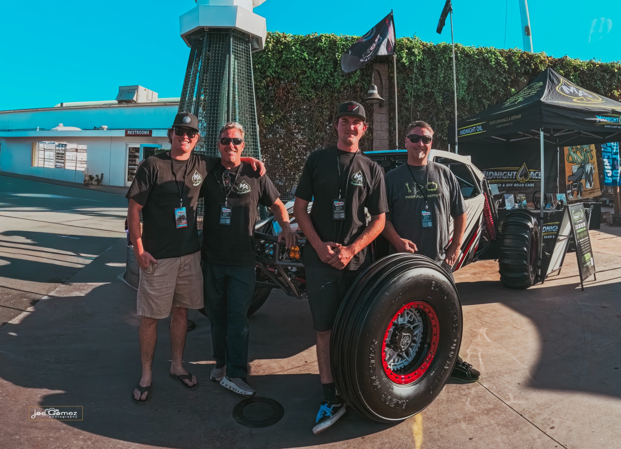 The Midnight Ace team alongside their completed sand rail at the Sand Sports Super Show
