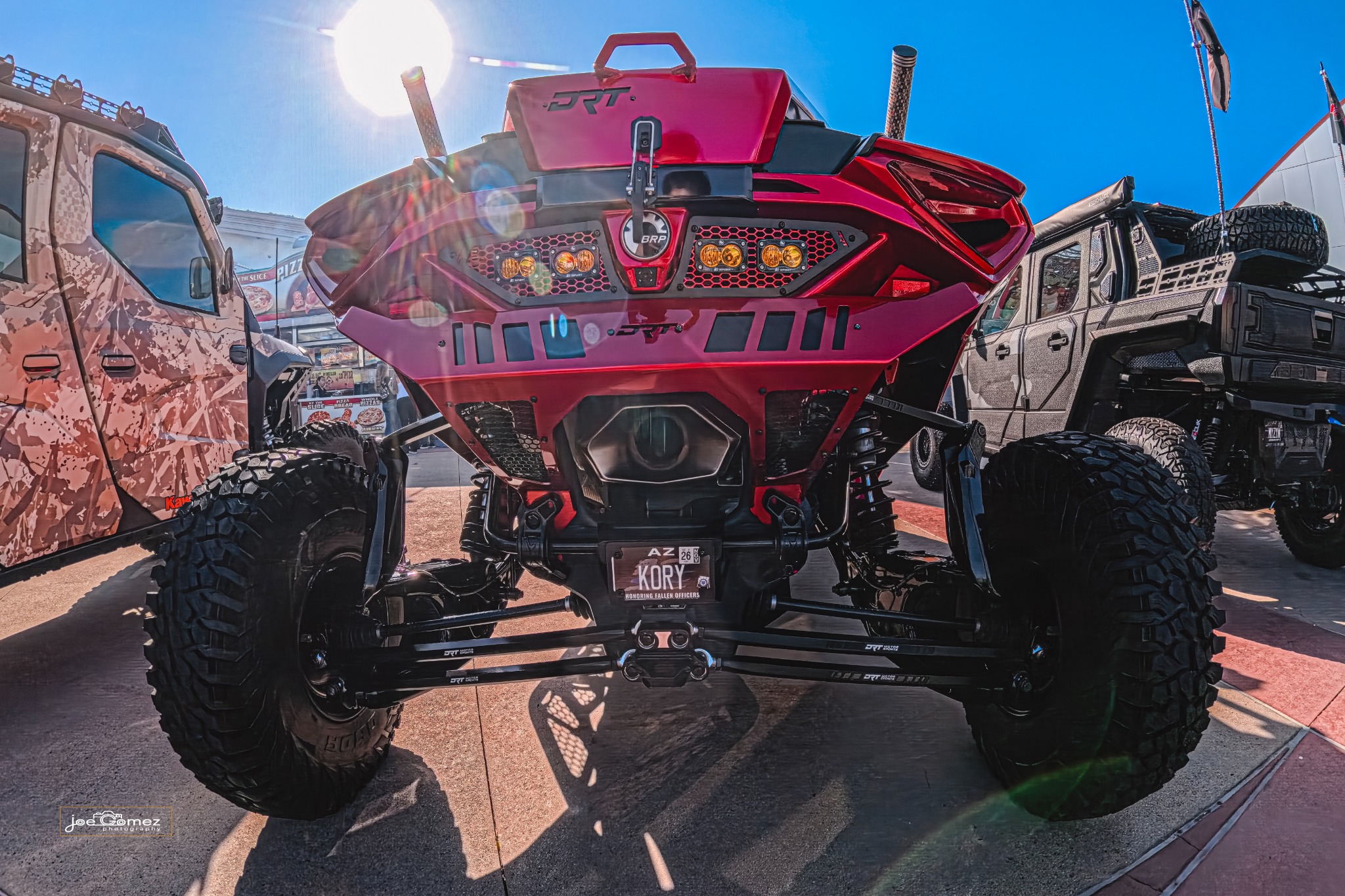 Straight rear view of the red off-road vehicle