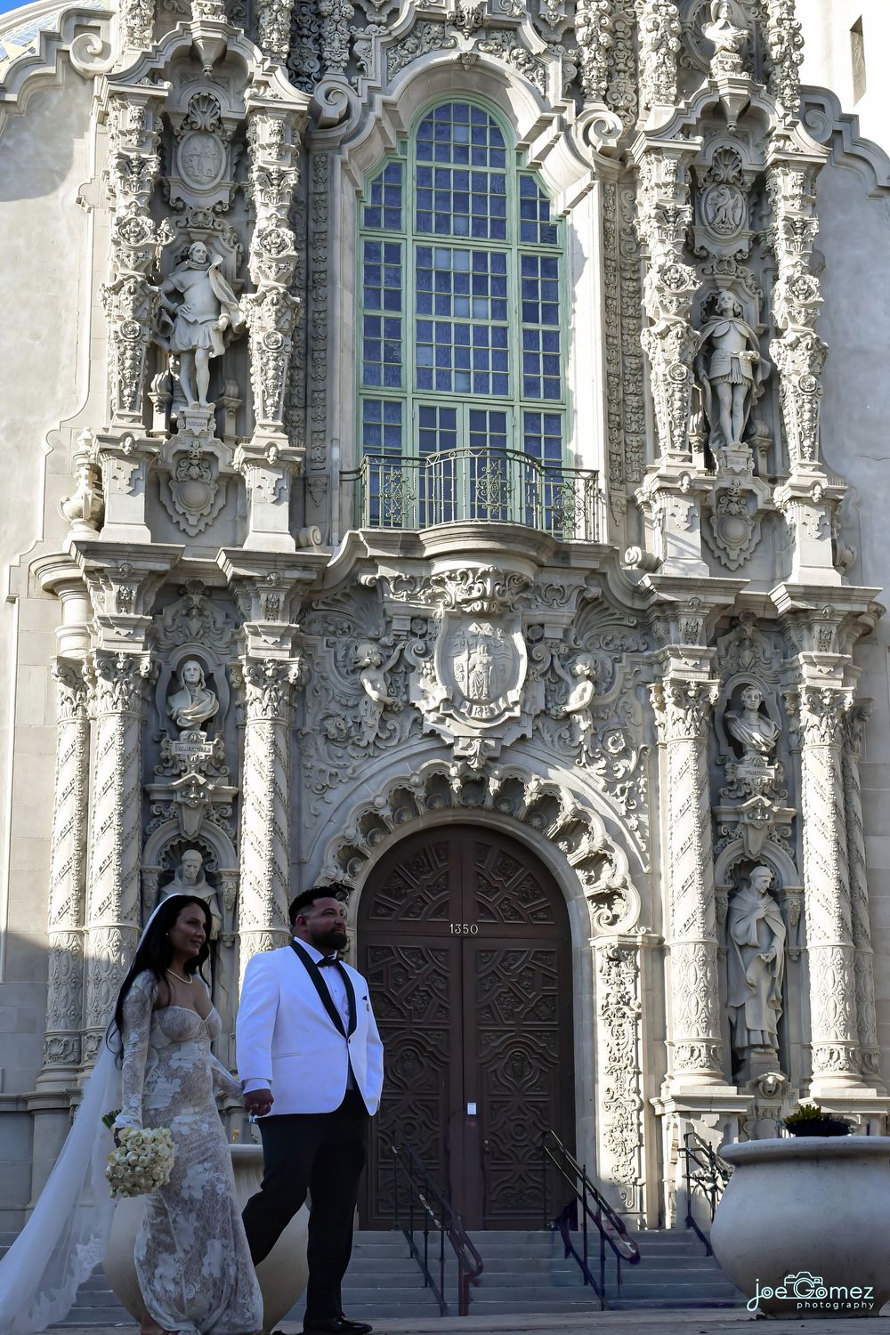 Editorial wedding portrait of a bride and groom outside Casa del Prado in Balboa Park, San Diego, photographed by Joe Gomez.